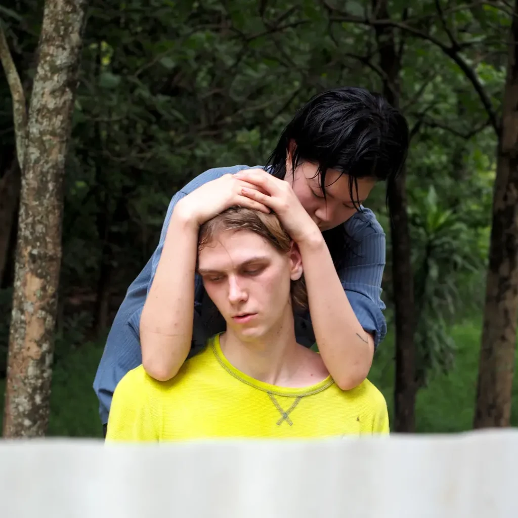 Ashleyho+domeniknaue is a collaborative duo creating transmedial performances that blend dance, poetry, music, and scenography. Their work, rooted in personal experiences, aims to foster collective imagination and transform harsh realities through vulnerability and playfulness. Nurtured by friendship and institutional support, their performances have been presented at various festivals, and they currently work across the Netherlands, Belgium, and Singapore after graduating from ArtEZ in 2022.