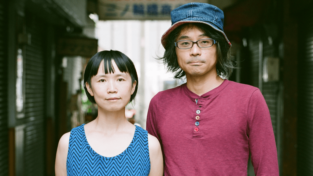 orangcosong is an art collective founded by Chikara Fujiwara and Minori Sumiyoshiyama, based in Yokohama / Kochi / Osaka (Japan), and active transnationally. Drawing on their experience in the performing arts and their travels, they create projects in close collaboration with local people, exploring themes of human mobility and gravity. 

In their flagship work, Engeki Quest, they conduct long-term, site-based research and stayed in Utrecht for a total of seven weeks across 2024 and 2025. For this edition of SPRING Festival, they present two projects: Engeki Quest and IsLand Bar. 

-- 
 
Chikara is an artist based in Yokohama. After studying political science at university, he worked as a magazine editor and theater critic. In 2014, he initiated Engeki Quest, a walk-based performance project realized in numerous cities worldwide. 

In 2017, he co-developed IsLand Bar with multinational artists at ADAM Artist Lab in Taipei. He has also created video works Stay Home Labyrinth (2020) and Maya/Dolores (2024). His practice centers on themes such as the “invisible walls” that generate prejudice and discrimination, and concepts of “mobility and gravity” related to migratory movement. He was a Saison Fellow of The Saison Foundation (2017–2020) and a Cultural Envoy of the Agency for Cultural Affairs of Japan (2017).
 
-- 

After studying architecture in Kyoto and beginning her career as a contemporary dancer, Minori now works as a transdisciplinary artist. Since 2017, she has presented Hitsudankai – From now/here, Silence, a performance in which participants communicate solely through handwritten notes in complete silence, across cities in Asia, Africa, and Europe. 

In 2020, she co-founded 2x2 WindowS, an online international project with multimedia composer Tam Thi Pham. In recent years, her practice has extended across both analog and digital realms, including video, graphic design, handicraft, cooking, and workshops exploring generative AI.